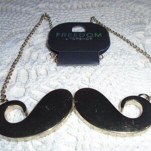 Big silly gold tone mustache necklace